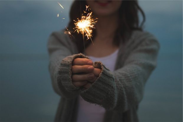 https://pixabay.com/photos/sparkler-holding-hands-firework-677774/