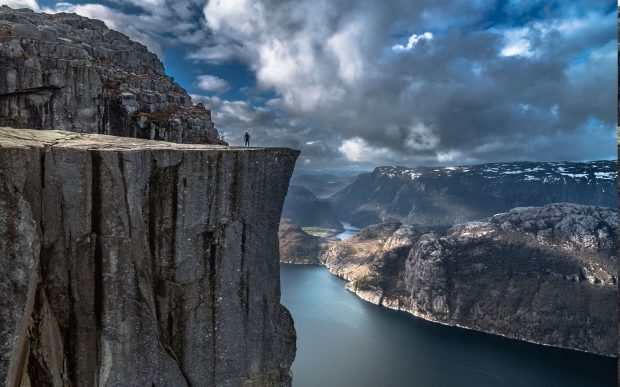 https://wallup.net/nature-landscape-fjord-alone-cliff-mountain-norway-preikestolen-sea-rock-calm-water-valley-europe-clouds/