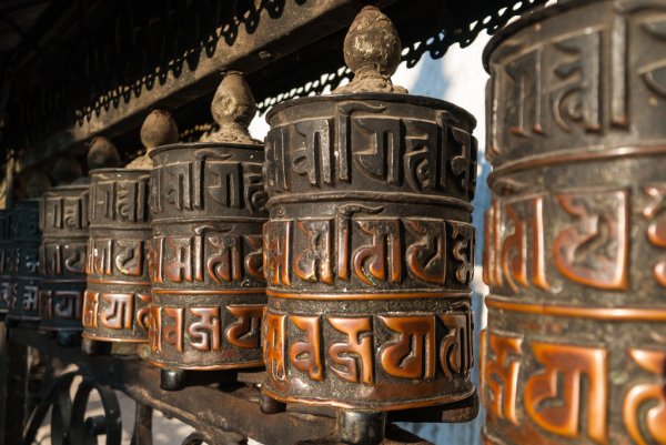 https://st2.depositphotos.com/2737683/10191/i/450/depositphotos_101918122-stock-photo-a-row-of-buddhist-prayer.jpg