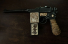 Štai tas mauzeris. https://www.reddit.com/r/Kaiserreich/comments/98egbc/rare_gun_of_baron_roman_von_ungern nuotr.